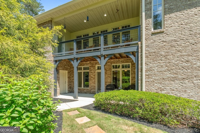 130 Allie Dr, Mcdonough, GA 30252 - rear view of property featuring a balcony and brick siding
