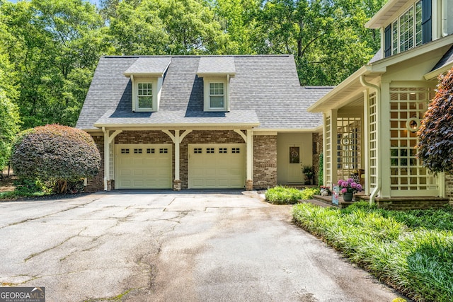 130 Allie Dr, Mcdonough, GA 30252 - view of front of home with asphalt driveway, roof with shingles, brick siding, and an attached garage