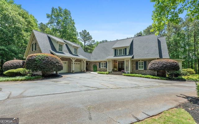 130 Allie Dr, Mcdonough, GA 30252 - view of front of house with driveway, a garage, and brick siding
