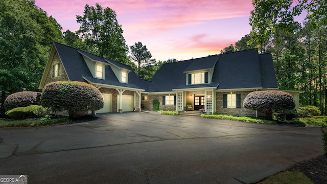 130 Allie Dr, Mcdonough, GA 30252 - view of front of house featuring french doors, driveway, stone siding, and an attached garage