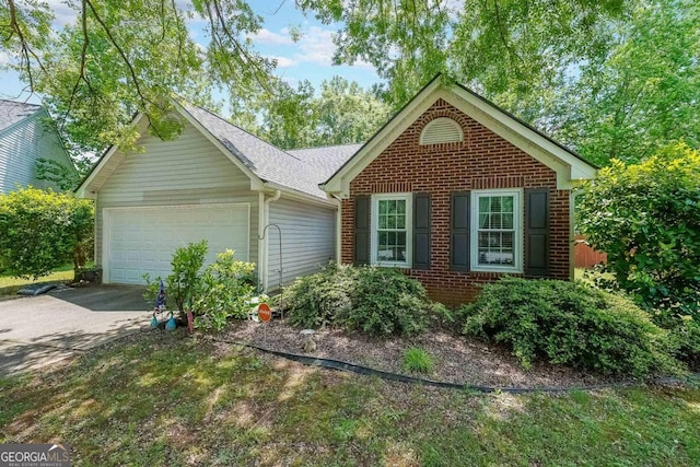 4872 Nature Trl, Austell, GA 30106 - view of front facade with concrete driveway, a garage, and brick siding