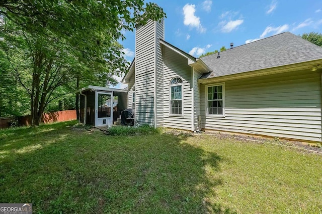 4872 Nature Trl, Austell, GA 30106 - rear view of property with a chimney, a sunroom, and a shingled roof