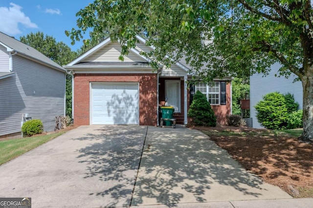 view of front facade with an attached garage, brick siding, and driveway