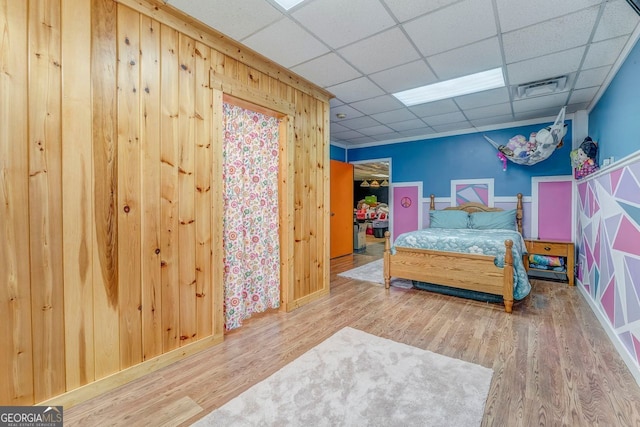 46 SW Colleen Karen Rd SW, Euharlee, GA 30120 - bedroom with wood finished floors, a drop ceiling, wooden walls, and baseboards