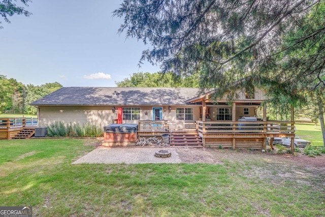 46 SW Colleen Karen Rd SW, Euharlee, GA 30120 - back of house with a hot tub, a patio area, a yard, a fire pit, and a wooden deck