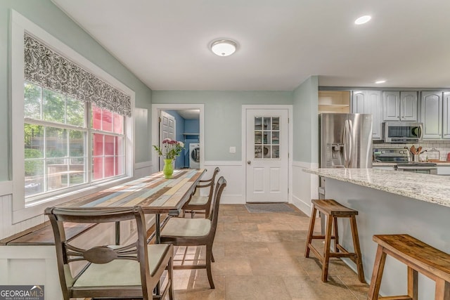 46 SW Colleen Karen Rd SW, Euharlee, GA 30120 - dining area with washer / clothes dryer, plenty of natural light, stone finish floors, a wainscoted wall, and recessed lighting