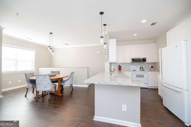 2114 Woodland Ln, Alpharetta, GA 30009 - kitchen with white appliances, a sink, white cabinets, and recessed lighting