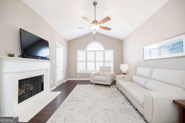 2114 Woodland Ln, Alpharetta, GA 30009 - living room featuring ceiling fan, vaulted ceiling, dark wood finished floors, and a fireplace