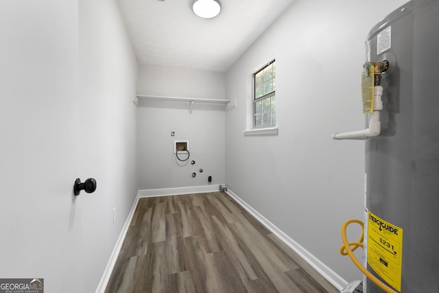 1425 Meadowind Ct SW, Conyers, GA 30094 - laundry room with washer hookup, water heater, wood finished floors, and baseboards