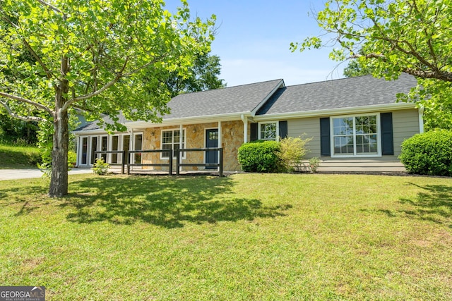 1404 Meadowind Ct SW, Conyers, GA 30094 - ranch-style house featuring a front yard, stone siding, and roof with shingles