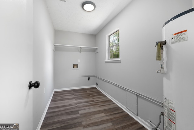 1404 Meadowind Ct SW, Conyers, GA 30094 - washroom featuring water heater, hookup for a washing machine, wood finished floors, electric dryer hookup, and baseboards