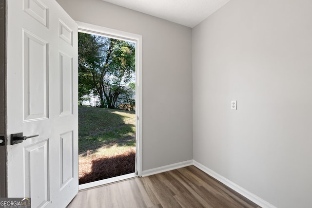 1404 Meadowind Ct SW, Conyers, GA 30094 - doorway to outside with wood finished floors and baseboards