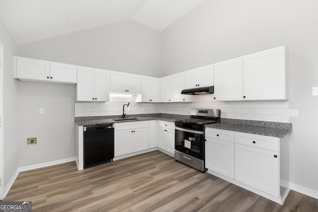 1404 Meadowind Ct SW, Conyers, GA 30094 - kitchen with stainless steel range with gas stovetop, black dishwasher, under cabinet range hood, high vaulted ceiling, and white cabinets