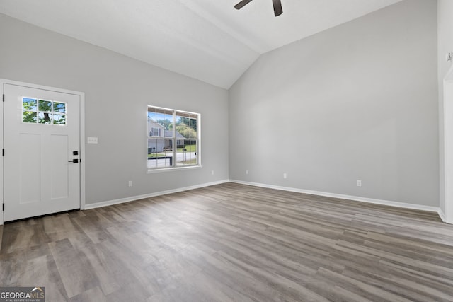 1404 Meadowind Ct SW, Conyers, GA 30094 - entrance foyer with healthy amount of natural light, ceiling fan, lofted ceiling, baseboards, and wood finished floors