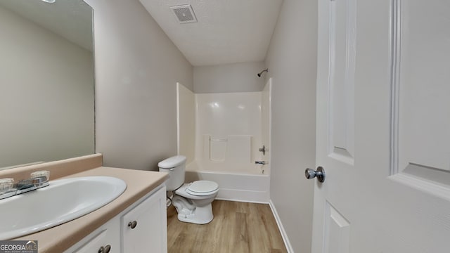 10961 Big Sky Dr, Hampton, GA 30228 - full bathroom featuring wood finished floors, vanity, and bathtub / shower combination