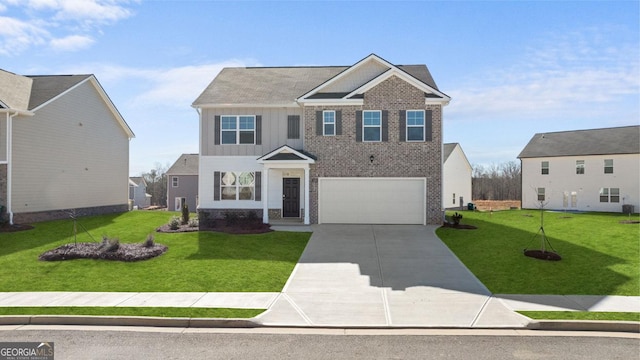75 Poplar Blvd, Newnan, GA 30265 - view of front of house with board and batten siding, concrete driveway, a front lawn, and a garage