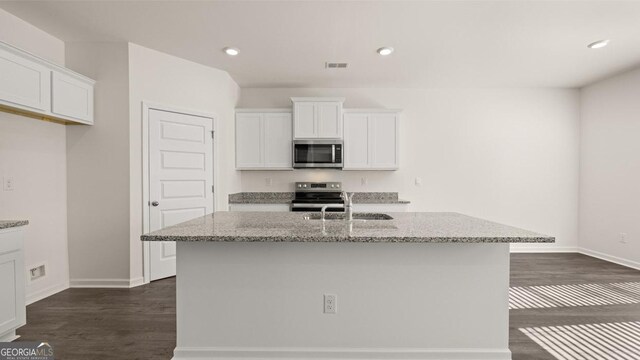 75 Poplar Blvd, Newnan, GA 30265 - kitchen featuring stainless steel appliances, a sink, dark wood finished floors, white cabinetry, and recessed lighting