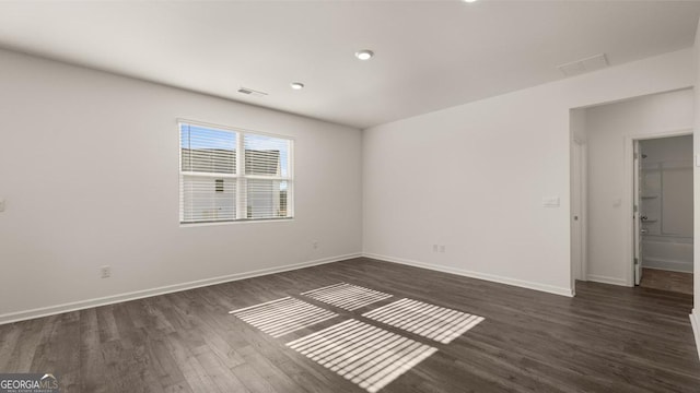75 Poplar Blvd, Newnan, GA 30265 - spare room featuring dark wood-type flooring, baseboards, and recessed lighting