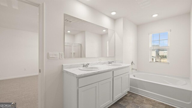 75 Poplar Blvd, Newnan, GA 30265 - full bathroom with a bath, double vanity, recessed lighting, and a shower with shower door