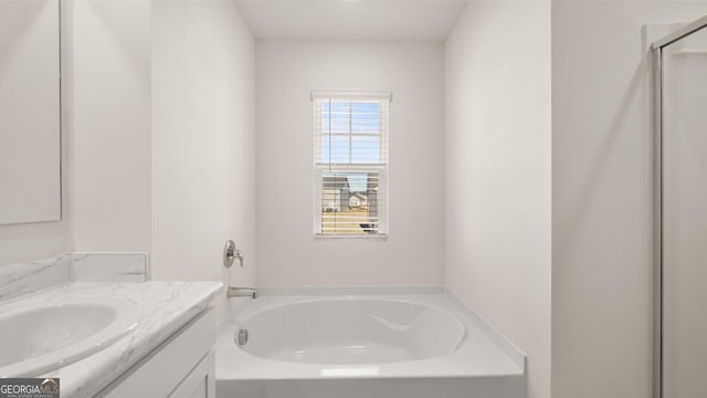75 Poplar Blvd, Newnan, GA 30265 - bathroom featuring vanity, a garden tub, and a shower with shower door