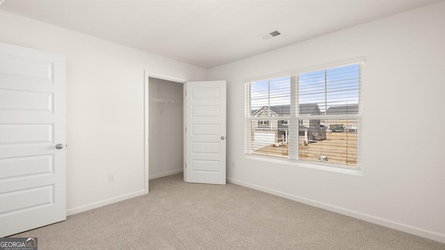 75 Poplar Blvd, Newnan, GA 30265 - unfurnished bedroom with carpet flooring, baseboards, and a closet