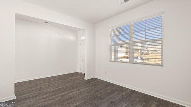 75 Poplar Blvd, Newnan, GA 30265 - unfurnished room with dark wood-style floors and baseboards