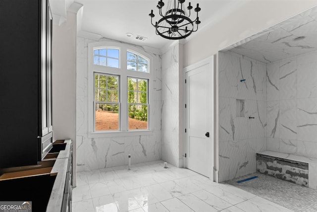1111 Swift Crk, Greensboro, GA 30642 - bathroom with marble look tiles and a chandelier