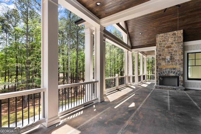 1111 Swift Crk, Greensboro, GA 30642 - view of patio / terrace featuring an outdoor stone fireplace