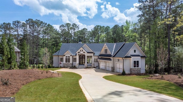 1111 Swift Crk, Greensboro, GA 30642 - view of front of house with driveway, a front lawn, a garage, a chimney, and stone siding