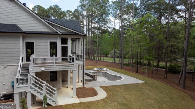 1111 Swift Crk, Greensboro, GA 30642 - view of green lawn with stairs, a patio area, a fire pit, and a wooden deck