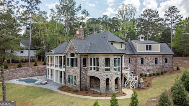 5010 Browns Ford Rd, Greensboro, GA 30642 - back of property with a patio area, a lawn, driveway, stone siding, and a chimney
