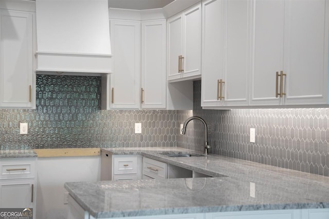 5010 Browns Ford Rd, Greensboro, GA 30642 - kitchen featuring white cabinets, light stone counters, and tasteful backsplash