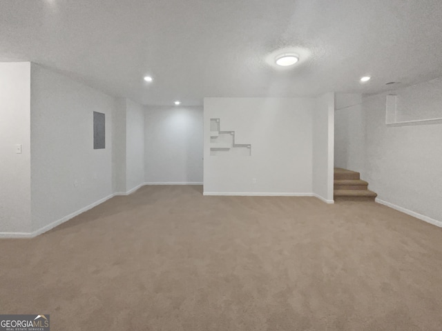 4335 Northwind Dr, Ellenwood, GA 30294 - finished below grade area with recessed lighting, light colored carpet, stairs, and baseboards