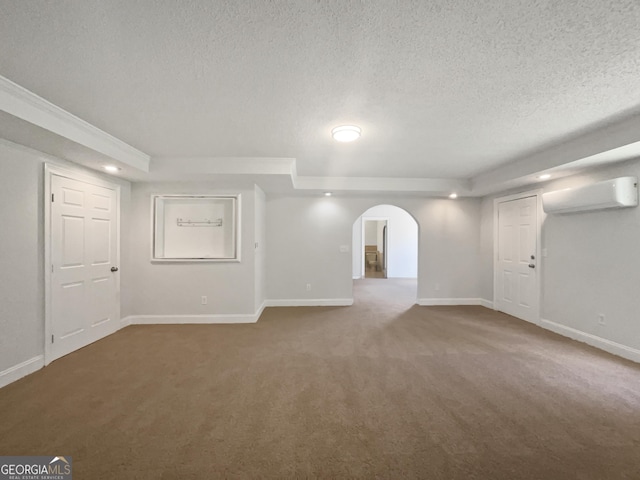 4335 Northwind Dr, Ellenwood, GA 30294 - basement featuring a wall mounted AC, a textured ceiling, carpet, baseboards, and recessed lighting
