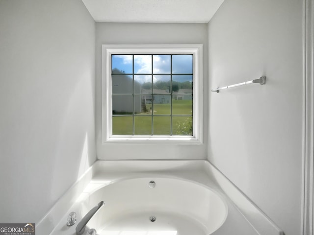 4335 Northwind Dr, Ellenwood, GA 30294 - bathroom with a bath