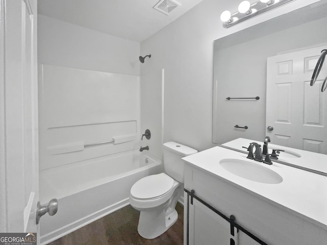 4335 Northwind Dr, Ellenwood, GA 30294 - bathroom with wood finished floors, toilet, vanity, and bathtub / shower combination