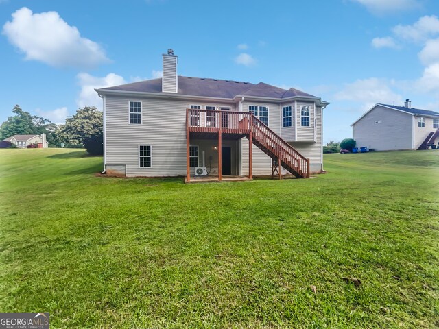 4335 Northwind Dr, Ellenwood, GA 30294 - back of house featuring stairway, a wooden deck, a chimney, and a yard