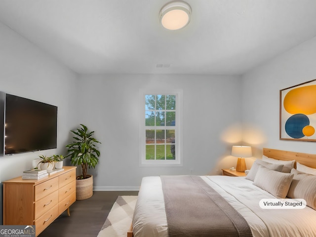 4335 Northwind Dr, Ellenwood, GA 30294 - bedroom featuring dark wood-type flooring and baseboards
