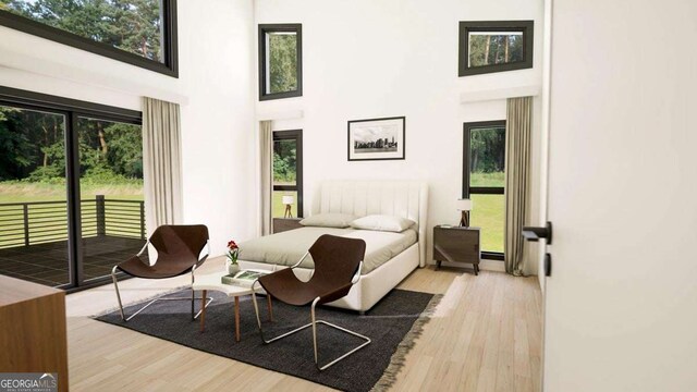 LL14 Coffey Ln, Young Harris, GA 30582 - bedroom featuring a high ceiling, access to outside, and wood finished floors