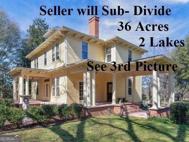 3021 Teamon Rd, Griffin, GA 30223 - back of property with a chimney, a porch, and a lawn