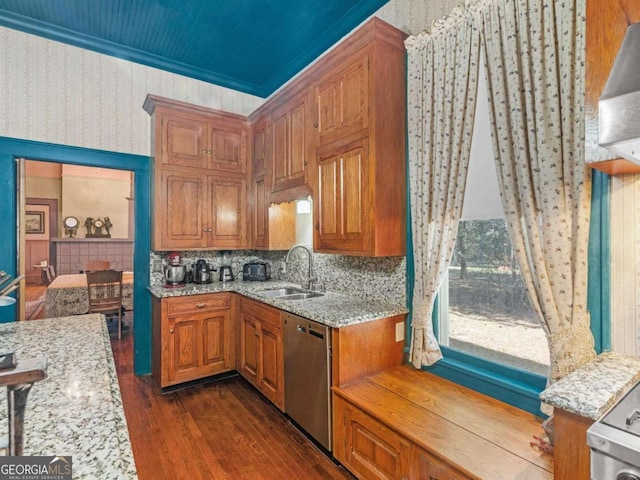 3021 Teamon Rd, Griffin, GA 30223 - kitchen featuring a sink, stainless steel dishwasher, wallpapered walls, dark wood-type flooring, and light stone counters