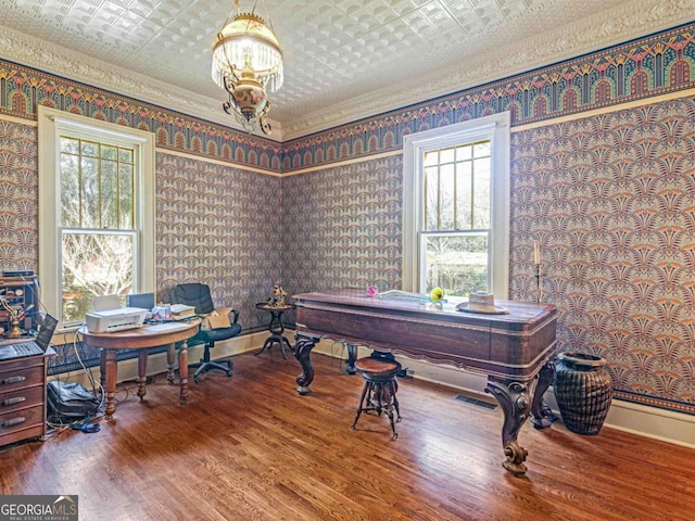 3021 Teamon Rd, Griffin, GA 30223 - home office featuring an ornate ceiling, wallpapered walls, a chandelier, wood finished floors, and plenty of natural light