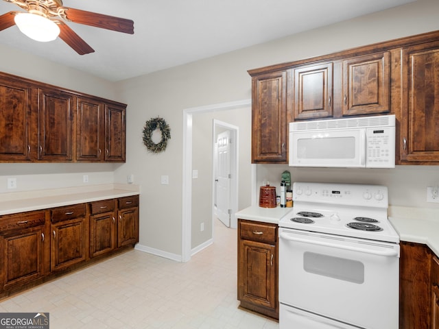 175 N Unity Grove Rd, Locust Grove, GA 30248 - kitchen featuring white appliances, a ceiling fan, light countertops, dark brown cabinetry, and baseboards