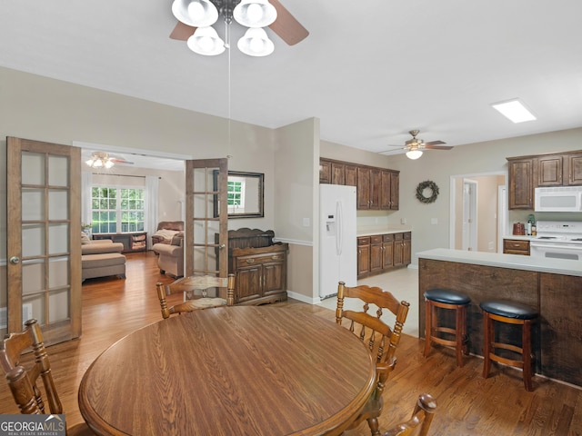 175 N Unity Grove Rd, Locust Grove, GA 30248 - dining space with ceiling fan and light wood-style flooring