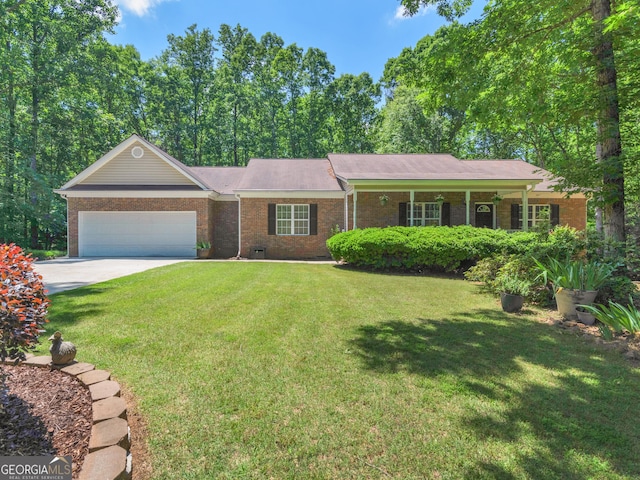 175 N Unity Grove Rd, Locust Grove, GA 30248 - single story home with brick siding, an attached garage, a front yard, and concrete driveway