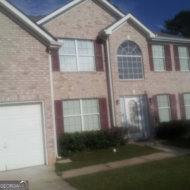 11950 Markham Way, Hampton, GA 30228 - view of front facade with brick siding and driveway