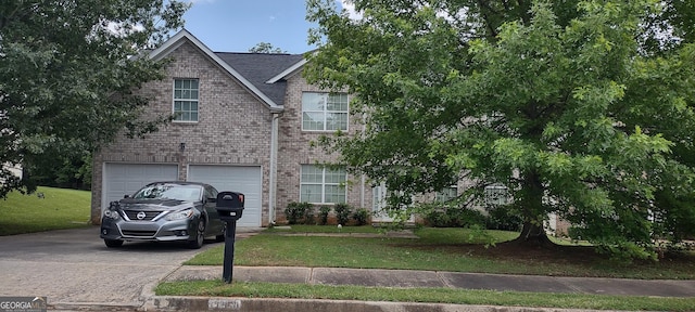 11950 Markham Way, Hampton, GA 30228 - view of front of house featuring driveway, brick siding, a garage, and a front yard