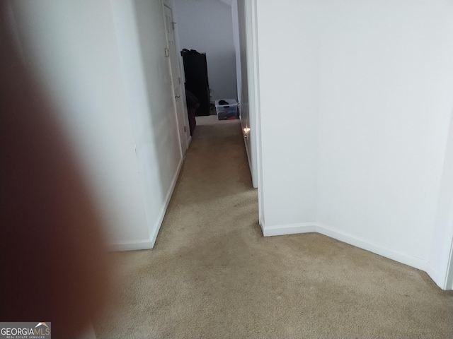11950 Markham Way, Hampton, GA 30228 - hallway featuring light carpet and baseboards