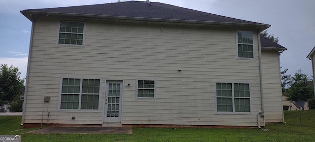 11950 Markham Way, Hampton, GA 30228 - back of house featuring a lawn and a patio area