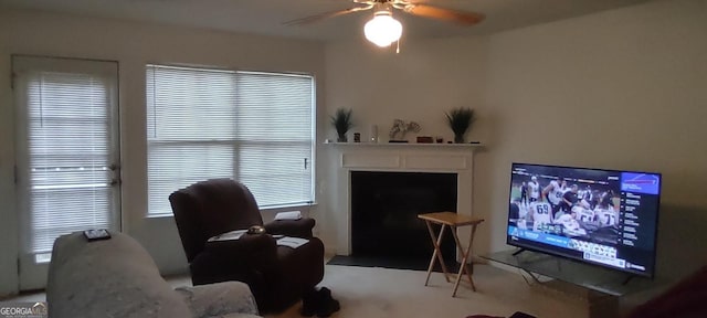 11950 Markham Way, Hampton, GA 30228 - living area featuring a ceiling fan, a fireplace with flush hearth, and carpet